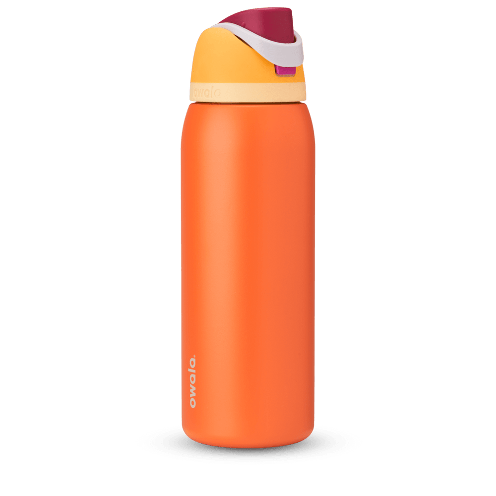 FreeSip 40oz in Citrus Crush, bright orange body with yellow flip cap, magenta carry loop, and cream accent band