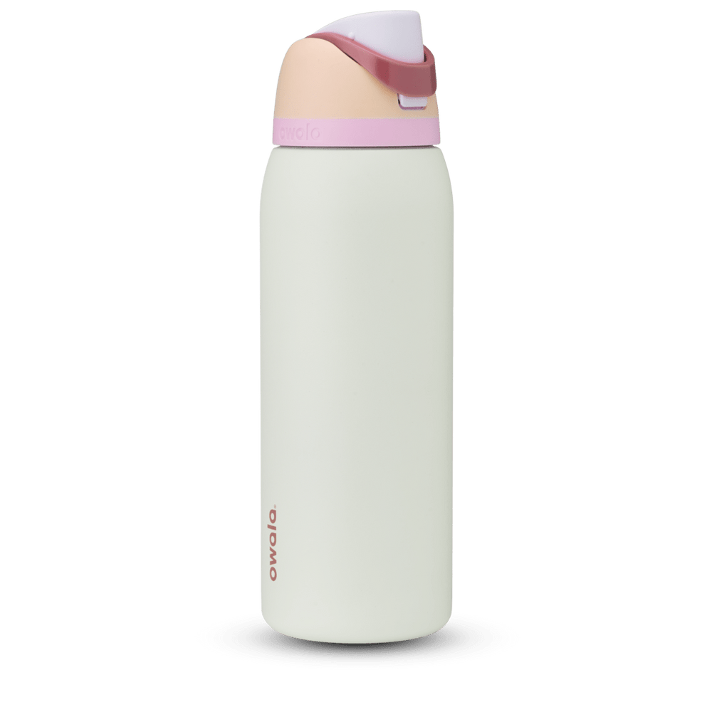 FreeSip 40oz in Coastal Mist, pale mint green body with peach flip cap, dusty rose carry loop, and pink accent band