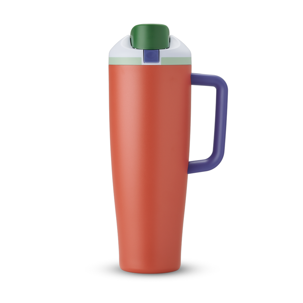FreeSip Tumbler 40oz in Summer Harvest — terracotta/burnt orange body with dark green lid and purple handle, viewed from the handle side