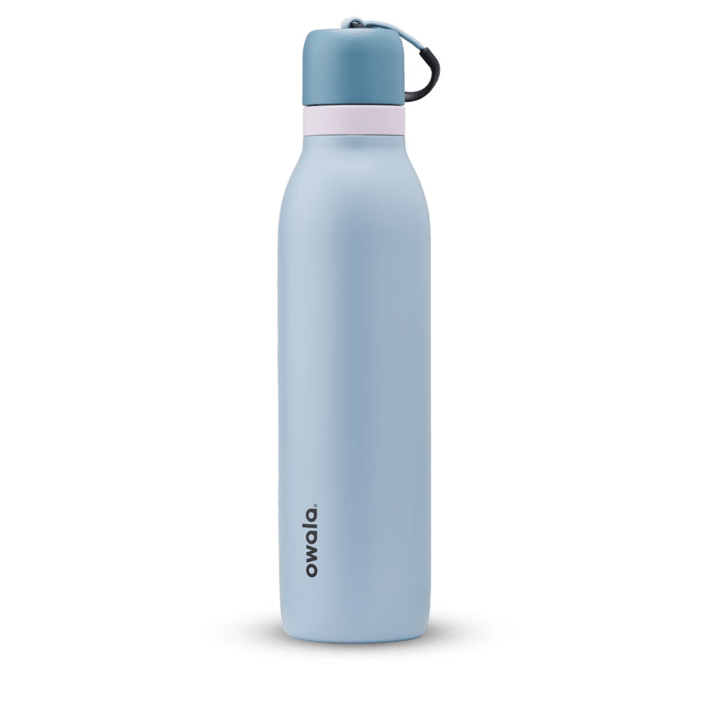 FreeSip Twist 24oz in Rainstorm, light powder blue insulated water bottle with darker slate blue twist cap, pale pink twist cap accent band, and dark navy carry string