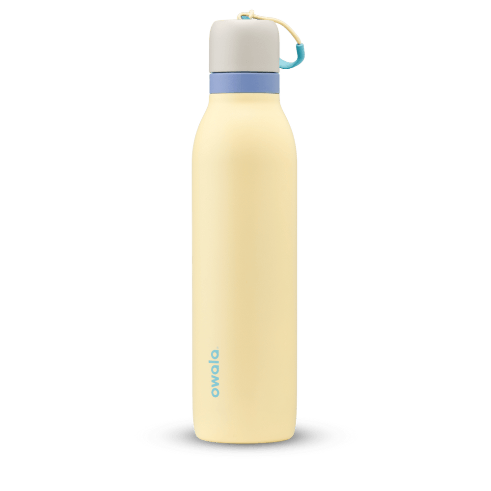 FreeSip Twist 24oz in Sunny Daze, pale yellow insulated water bottle with light gray twist cap, periwinkle blue twist cap accent band, and teal carry string with grip